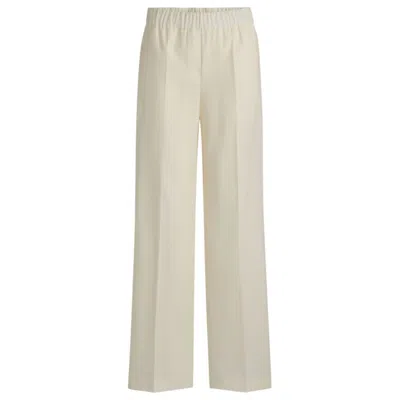 HUGO BOSS RELAXED-FIT TROUSERS IN WOOL