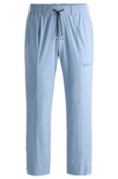Hugo Boss Relaxed-fit Trousers With Double-monogram Badge In Light Blue
