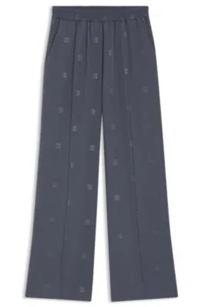 Hugo Boss Relaxed-fit Trousers With Stacked Logos In Blue