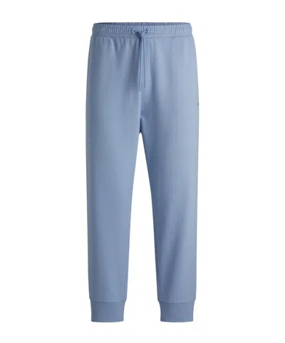 Hugo Boss Solid Color Curved Joggers In Blue