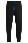 Hugo Boss Stretch-cotton Tracksuit Bottoms With Embossed Artwork In Black