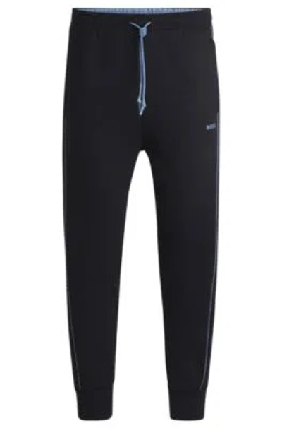 Hugo Boss Stretch-cotton Tracksuit Bottoms With Embossed Artwork In Dark Blue