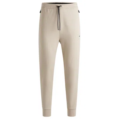 Hugo Boss Stretch Tracksuit Bottoms With Logo Patch In Beige