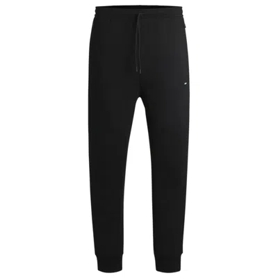 HUGO BOSS STRETCH TRACKSUIT BOTTOMS WITH LOGO PATCH