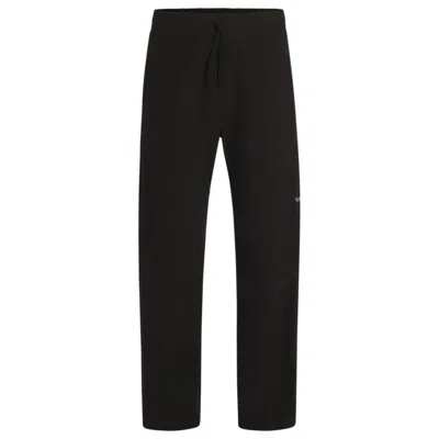 Hugo Boss Tapered-fit Tracksuit Bottoms In Ripstop Cotton In Grey