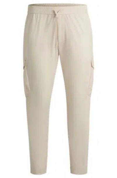 Hugo Boss Tapered-fit Trousers In Easy-iron Stretch Poplin In White