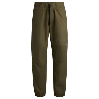 Hugo Boss Tapered-fit Trousers In Structured Cotton In Green