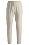 Hugo Boss Tracksuit Bottoms In Stretch Fabric With Decorative Reflective Logo In Light Beige
