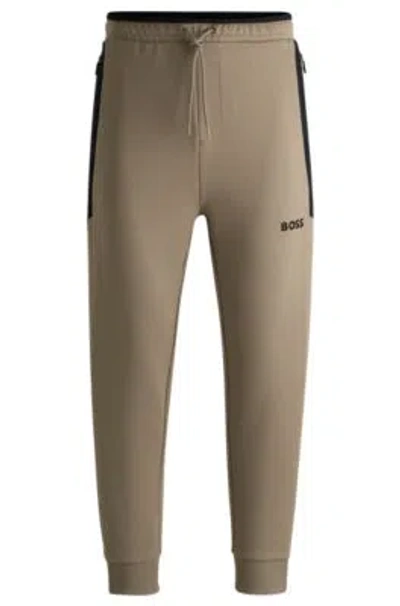 HUGO BOSS TRACKSUIT BOTTOMS WITH 3D-MOLDED LOGO