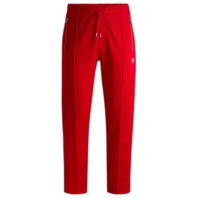 Hugo Boss Tracksuit Bottoms With Checked Tape In Pink