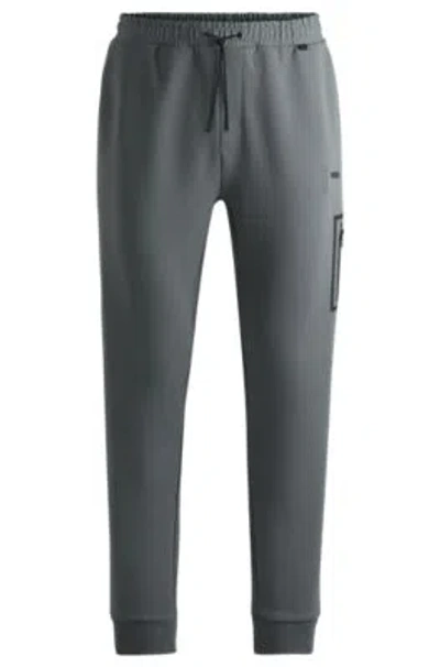 Hugo Boss Tracksuit Bottoms With Decorative Reflective Logo In Khaki
