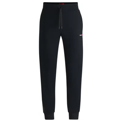 Hugo Boss Tracksuit Bottoms With Heart Logo In Black