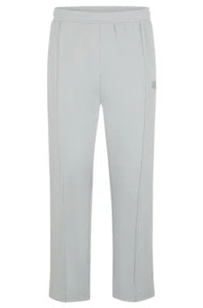 Hugo Boss Tracksuit Bottoms With Logo Artwork In Light Grey