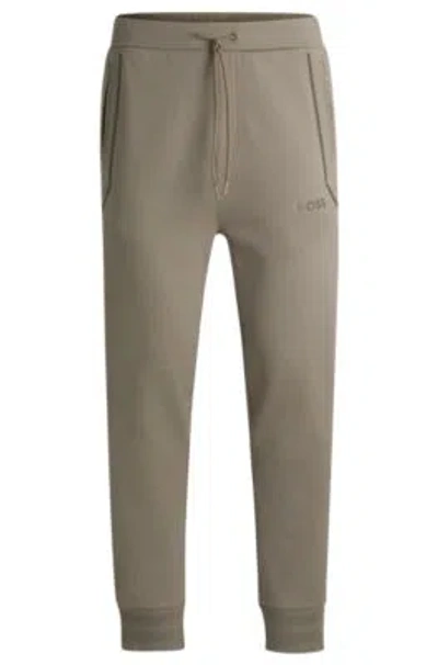 Hugo Boss Tracksuit Bottoms With Mirror-effect Logo In Light Green