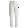Hugo Boss Tracksuit Bottoms With Red Logo Label In White