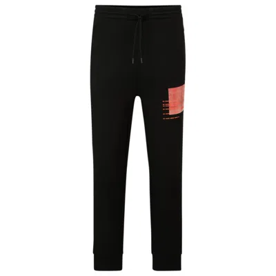 Hugo Boss Tracksuit Bottoms With Seasonal Artwork In Black