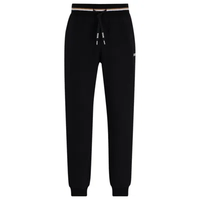 HUGO BOSS TRACKSUIT BOTTOMS WITH STRIPES AND LOGOS