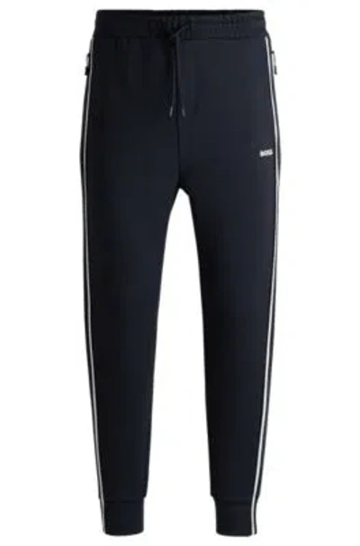 Hugo Boss Tracksuit Bottoms With Tape Inserts In Dark Blue
