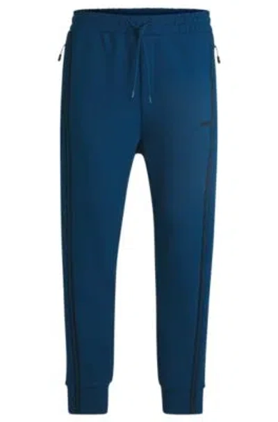 Hugo Boss Tracksuit Bottoms With Tape Inserts In Light Blue