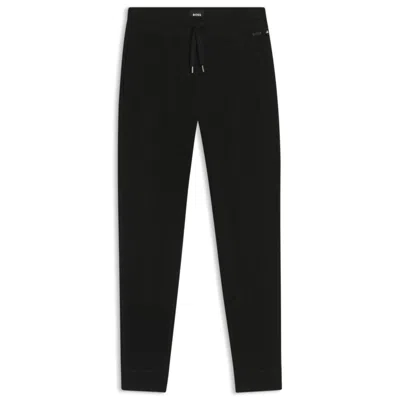 Hugo Boss Waffle-structure Tracksuit Bottoms In A Cotton Blend In Black