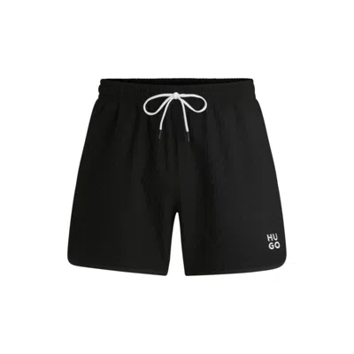 Hugo Boss Waffle-structured Swim Shorts With Embroidered Stacked Logo In Black