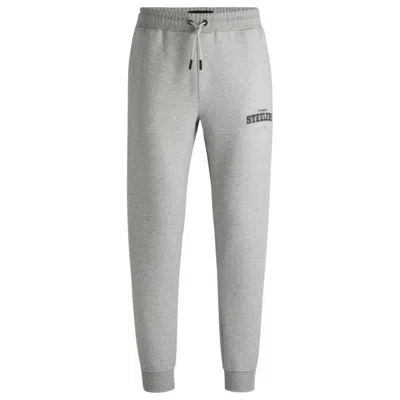 Hugo Boss X Nfl Signature-tape Tracksuit Bottoms With Special Branding In Gray