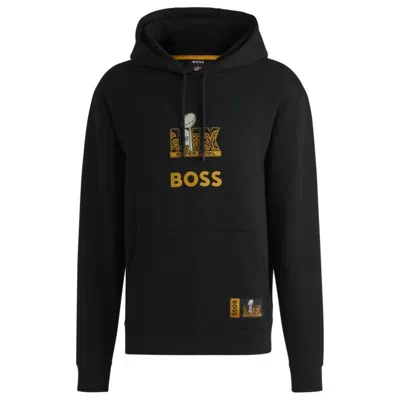 Hugo Boss X Nfl Stretch Hoodie With Gold-tone Artwork In Black