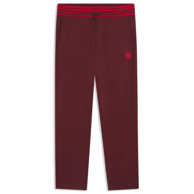 Hugo Boss X Rb Oversize-fit Tracksuit Bottoms With Striped Waistband In Red