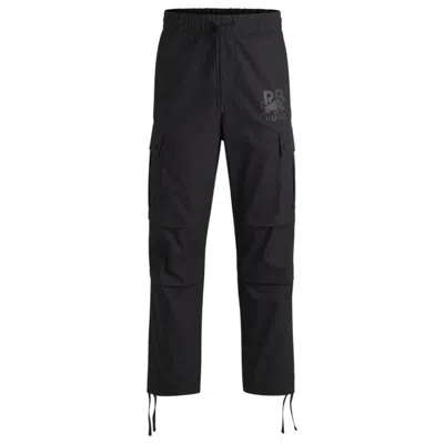 Hugo Boss X Rb Regular-fit Trousers With Carbon Stealth Logo In Black