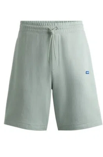 Hugo Cotton-terry Shorts With Blue Logo Patch In Light Green
