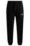 Hugo Boss Cotton-terry Tracksuit Bottoms With Logo Print In Black