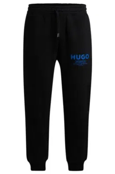 Hugo Boss Cotton-terry Tracksuit Bottoms With Logo Print In Black