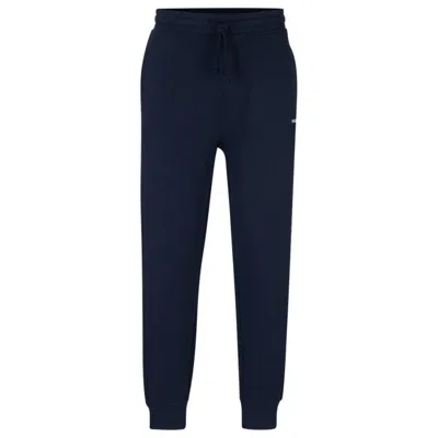 Hugo Boss Cotton-terry Tracksuit Bottoms With Logo Print In Blue