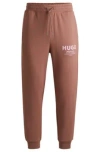 Hugo Boss Cotton-terry Tracksuit Bottoms With Logo Print In Brown