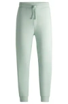 Hugo Boss Cotton-terry Tracksuit Bottoms With Logo Print In Light Green