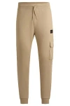 Hugo Boss Cotton-terry Tracksuit Bottoms With Logo Trim In Neutral