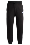 Hugo Boss Cotton-terry Tracksuit Bottoms With Smiley-face Logo Patch In Black