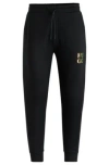 Hugo Boss Cotton-terry Tracksuit Bottoms With Stacked Logo In Black
