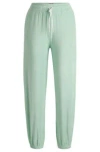 Hugo Boss Cuffed Tracksuit Bottoms In Terry Fabric With Handwritten Logo In Light Green