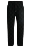 Hugo Boss Loose-fit Tracksuit Bottoms With Checkerboard Print In Black