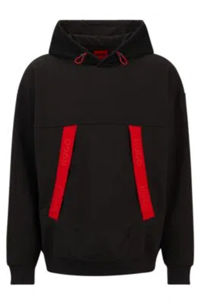 Hugo Oversize-fit Hoodie With Red Logo Tape In Black