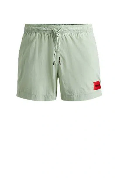 Hugo Boss Quick-dry Swim Shorts With Red Logo Label In Gold