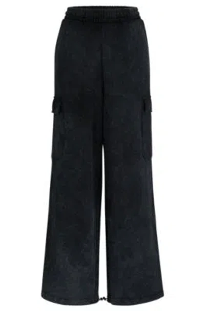 Hugo Relaxed-fit Cargo Tracksuit Bottoms In A Cotton Blend In Black