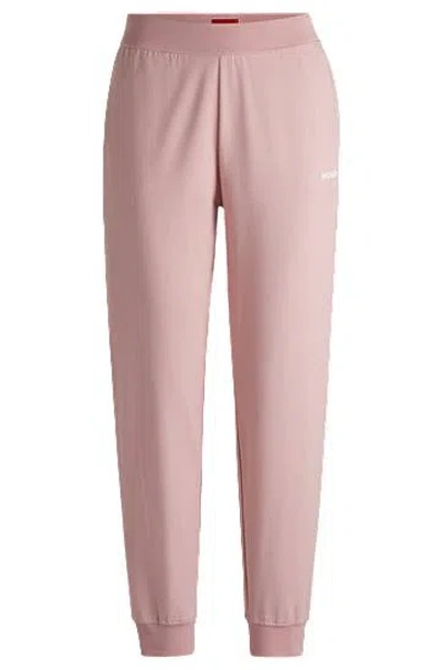 Hugo Boss Relaxed-fit Tracksuit Bottoms With Printed Logo In Pink