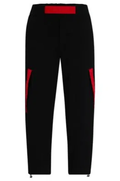 Hugo Boss Relaxed-fit Tracksuit Bottoms With Red Logo Tape In Black