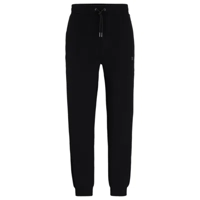 HUGO STRETCH-COTTON TRACKSUIT BOTTOMS WITH STACKED LOGO