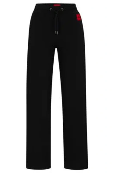 Hugo Tracksuit Bottoms With Logo Label In Black