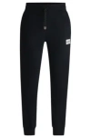 Hugo Boss Tracksuit Bottoms With Metallic Logo Label In Black