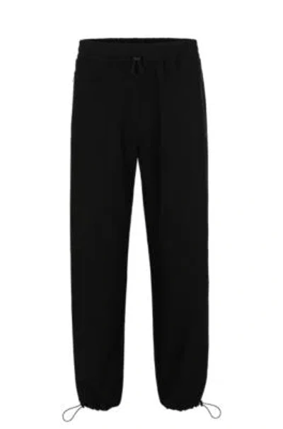 Hugo Boss Water-repellent Trousers With Adjustable Hems In Black