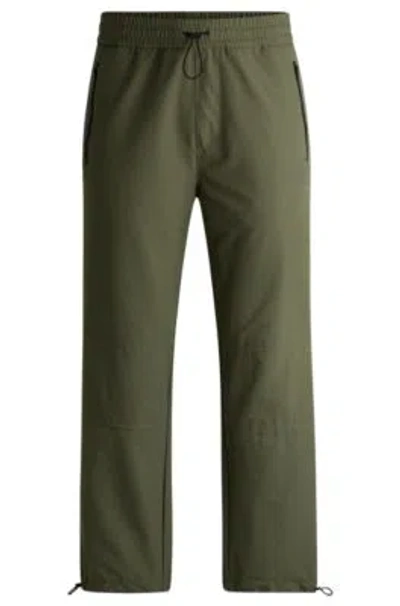 Hugo Boss Water-repellent Trousers With Adjustable Hems In Khaki